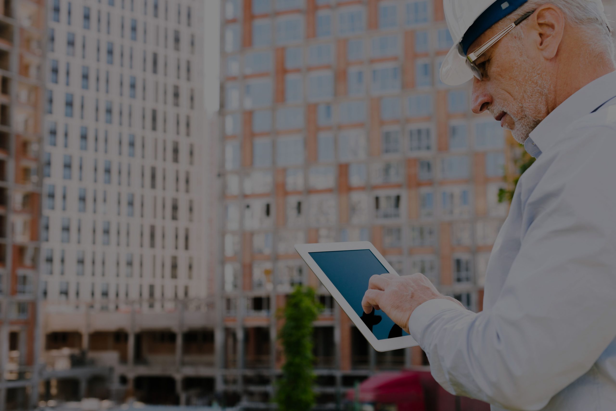 side-view-old-man-looking-tablet-modified (1)